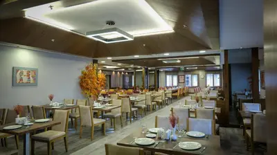 a dining room with tables and chairs in a restaurant at Kervansaray Bursa City Hotel in Bursa