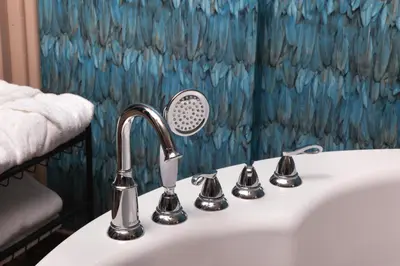 a bathroom sink with a faucet and a shower curtain at Harbiye Residence in Istanbul