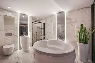 a large white bathroom with a tub and a toilet at Harbiye Residence in Istanbul
