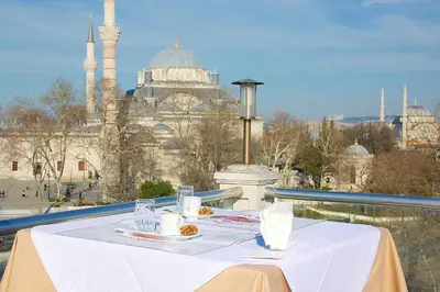 a white table with a view of the blue mosque at Emporium Hotel in Istanbul