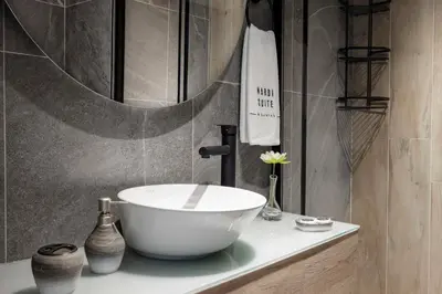 a bathroom with a bowl sink and a mirror at Nardi Nişantaşı in Istanbul
