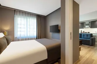 a hotel room with a bed and a couch at Nardi Nişantaşı in Istanbul