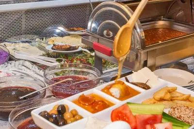 a buffet with a lot of food on a table at Sahil Boutique Hotel in Istanbul