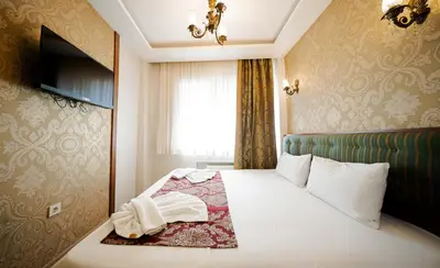 a hotel room with a bed and a window at Sahil Boutique Hotel in Istanbul