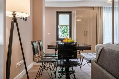 a dining room with a table with fruit on it at Çırağan Apart Bosphorus in Istanbul