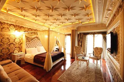 a bedroom with a bed with a coffered ceiling at Deluxe Golden Horn Sultanahmet Hotel in Istanbul