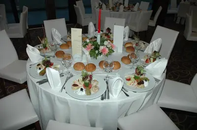 a white table with plates of food on it at Burcman Hotel in Bursa