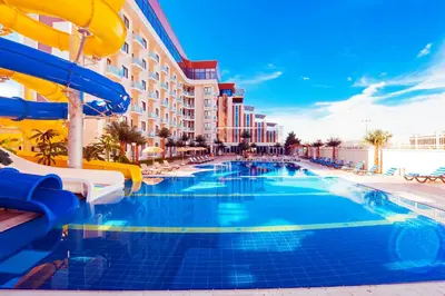 a pool at a resort with a water slide at Elegance Resort Hotel & SPA Wellness-Aqua in Yalova