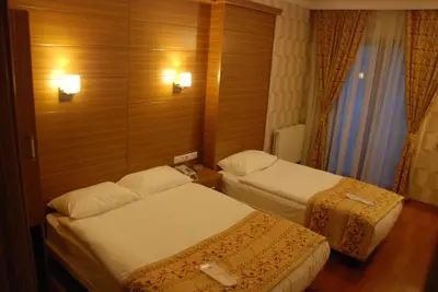 a hotel room with two beds in a room at The Port Hotel in Istanbul
