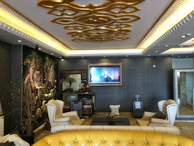 a living room with a couch and a tv at The Port Hotel in Istanbul