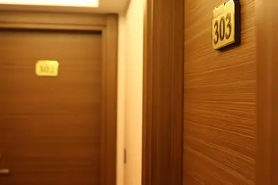 a door with a speed limit sign on it at RİVADA HOTEL in Kartepe