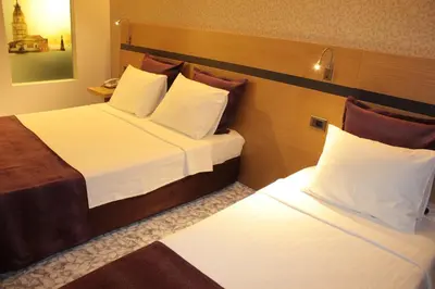 a hotel room with two beds in a room at Hotel Osaka Airport in Istanbul