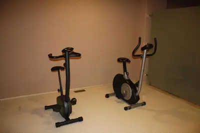two exercise bikes in a room with a wall at Hotel Osaka Airport in Istanbul