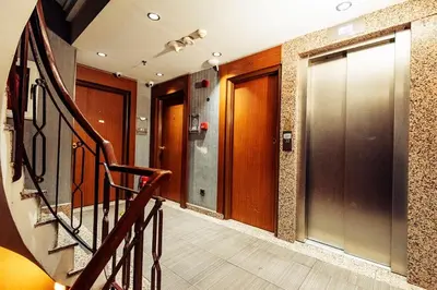 a hallway with a staircase and a lobby with doors at Style Star Hotel Cihangir in Istanbul