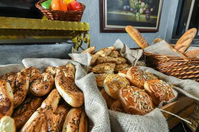 a bunch of different types of bread in baskets at Style Star Hotel Cihangir in Istanbul