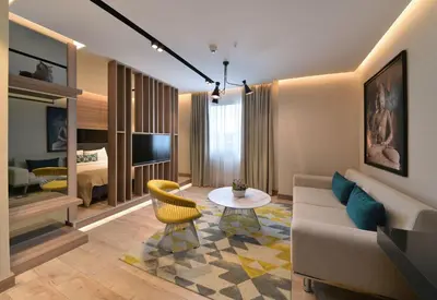 a living room with a couch and a table at Nish Palace Exlusive Suites in Istanbul