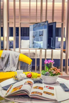 a table with an open book and a bowl of fruit at Nish Palace Exlusive Suites in Istanbul