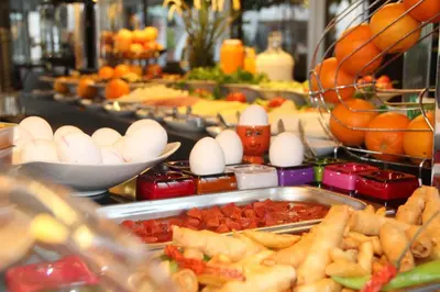 a buffet of food with eggs and other foods at Payidar HOTEL in Istanbul