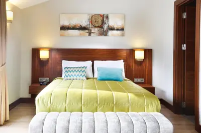 a bedroom with a large bed with two pillows at The White Orient Hotel in Istanbul
