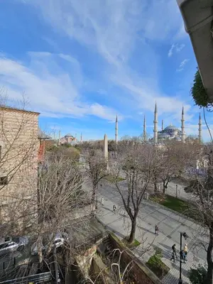 a view of a city with a mosque in the background at Optimist Hotel in Istanbul