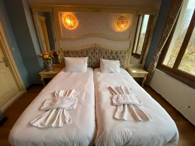 a bedroom with two beds with towels on them at Optimist Hotel in Istanbul