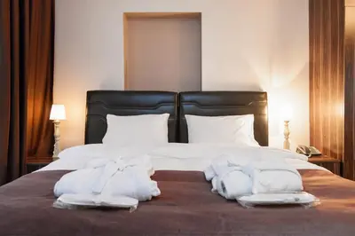 a bedroom with a bed with towels on it at Résidence Le Rêve in Istanbul