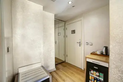a kitchen with a hallway with a door and a counter at Ayasultan Hotel in Istanbul