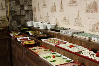 a buffet line with many different types of food at Ayasultan Hotel in Istanbul
