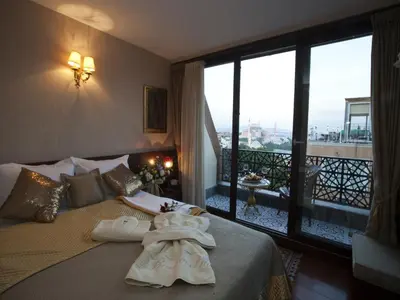 a hotel room with a bed with towels on it at Burckin Hotel in Istanbul