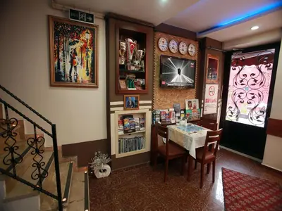 a dining room with a table and chairs in a room at Arife Sultan Hotel in Istanbul