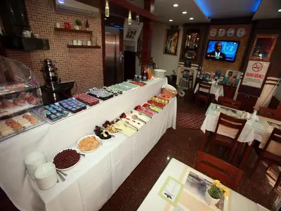 a buffet line in a restaurant with many different foods at Arife Sultan Hotel in Istanbul