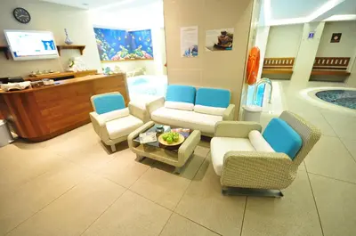 a waiting room with chairs and a table in a hospital at Neorion Hotel - Special Class in Istanbul