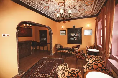 a living room with a chandelier and a mirror at Cheers Vintage Hostel in Istanbul