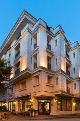 a large white building with tables in front of it at Recital Hotel in Istanbul