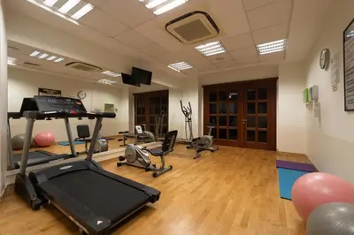 a gym with a treadmill and several exercise bikes at Recital Hotel in Istanbul