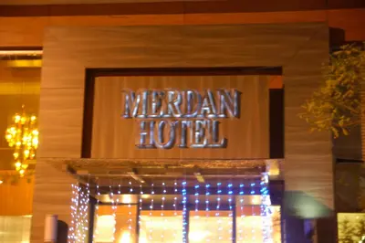a sign for a marriott hotel with christmas lights at Merdan Hotel in Istanbul