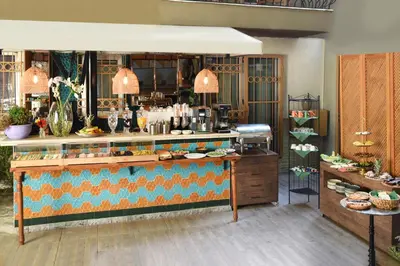 a restaurant with a counter with food on it at The Marions Suite istanbul Special Category Taksim in Istanbul