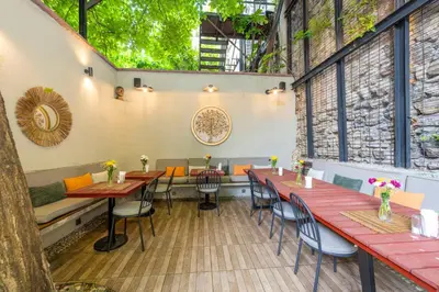 a restaurant with tables and chairs in a room at The Marions Suite istanbul Special Category Taksim in Istanbul