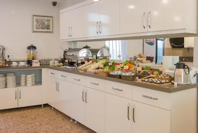 a kitchen with a lot of food on a counter at Goldhan Hotel in Tekirdag