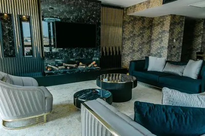 a living room with a couch and a fireplace at Hilton Garden Inn Yalova in Yalova