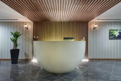 a lobby with a large white counter in a room at Hilton Garden Inn Yalova in Yalova