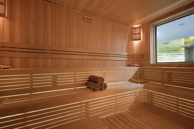 a sauna with a bench with a pillow in it at Hilton Garden Inn Yalova in Yalova