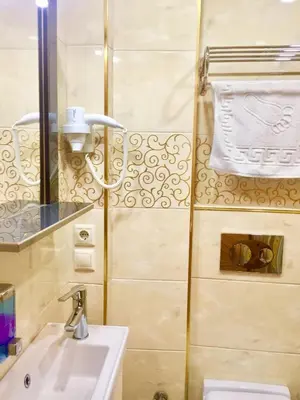 a bathroom with a sink and a mirror at ARINÇ HOTEL in Istanbul