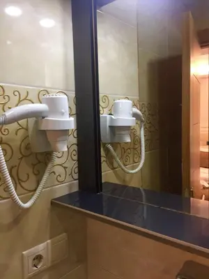 a bathroom with two sinks and a mirror at ARINÇ HOTEL in Istanbul