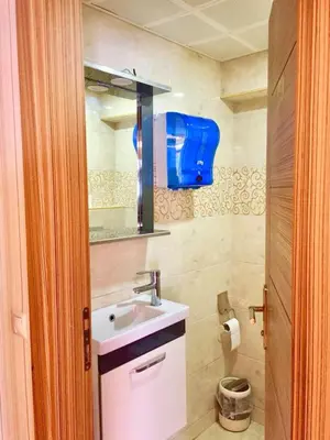 a bathroom with a sink and a mirror at ARINÇ HOTEL in Istanbul