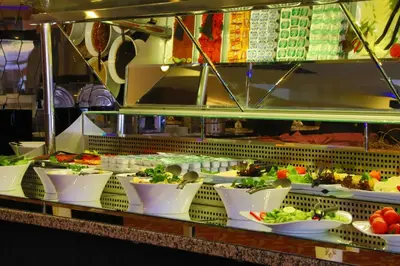 a buffet line with bowls of food on display at Arya Hotel Sakarya in Sakarya