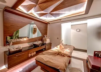a bathroom with a bed and a sink and a mirror at The Elysium Taksim in Istanbul
