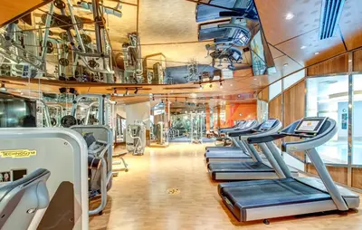 a gym with rows of treadmills and machines at The Elysium Taksim in Istanbul