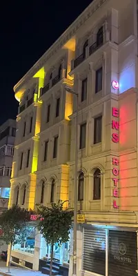 a large white building with a sign on it at Ens Hotel in Istanbul