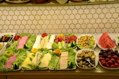 a buffet of different types of food on a table at Sultans Royal Hotel in Istanbul
